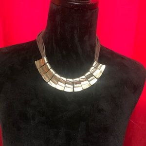 Gold and leather necklace